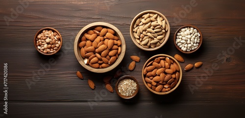 Row of various kinds of almonds on a wooden table. generative ai