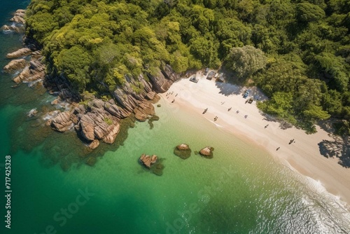 An overhead view of a coastal landscape with sandy beaches, crystal clear water, and lush trees along the shoreline. Generative AI