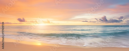 Golden Sunset Over Tranquil Ocean Waves © DavidGalih | Dikomo.