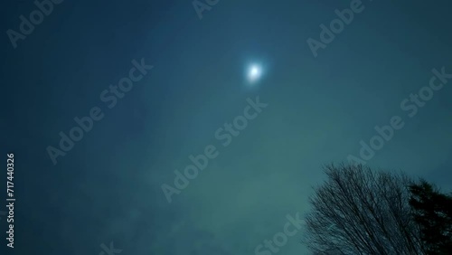 Timelapse of the moon late at night.