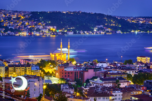 Istanbul, Turkey. View of the mosque Ortakoy, Bosphorus and the city in the evening after sunset photo