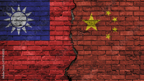Photography China versus Taiwan, the two flags of the countries on an old brick wall, separa