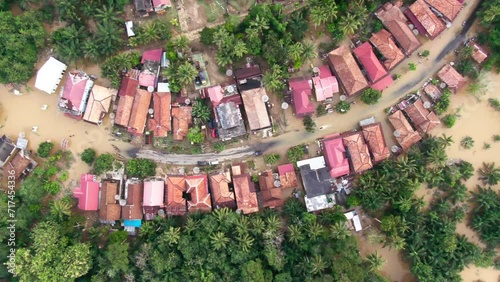 Aerial footage of villages and residents houses being submerged by overflowing rivers which resulted in flooding in Musi Rawas Utara, South Sumatra, Indonesia 4K Drone Video | Banjir Musi Rawas Utara photo