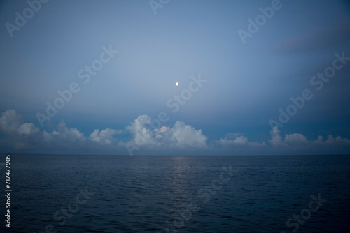 Mentawai Islands Indonesia Moon rise and clouds photo