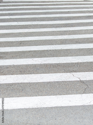 White stripes on an asphalt road. Crosswalk