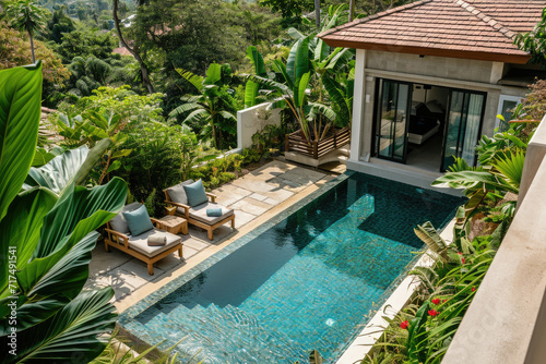 high view of Luxurious tropical pool villa with refined architecture in a lush greenery garden