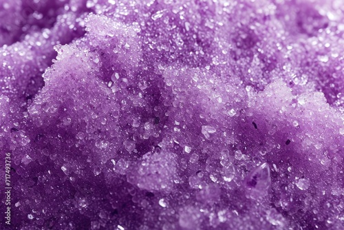 Macro photo of purple indigo body scrub with fruit extract as cosmetic background