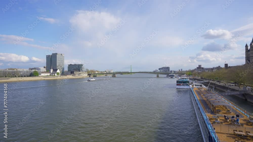 Rhine River With Ships Accosted On The Shore, Cologne, Germany Rhine River With Ships Accosted On The Shore, Cologne, Germany