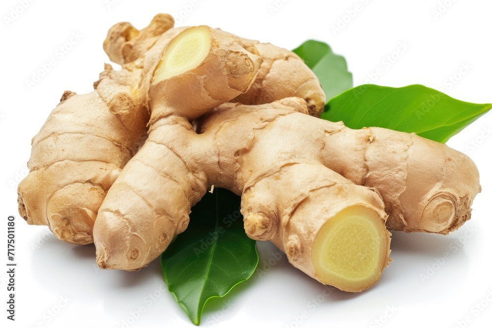 Isolated ginger root with leaves on white background