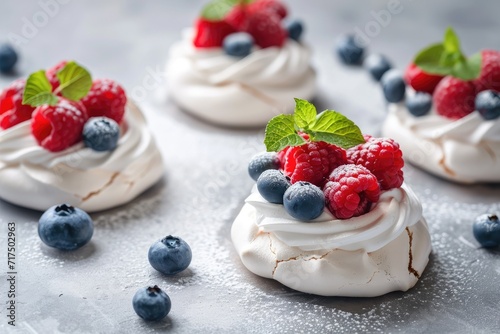 Mini Pavlova Cake with fresh raspberries blueberries mint and a soft center