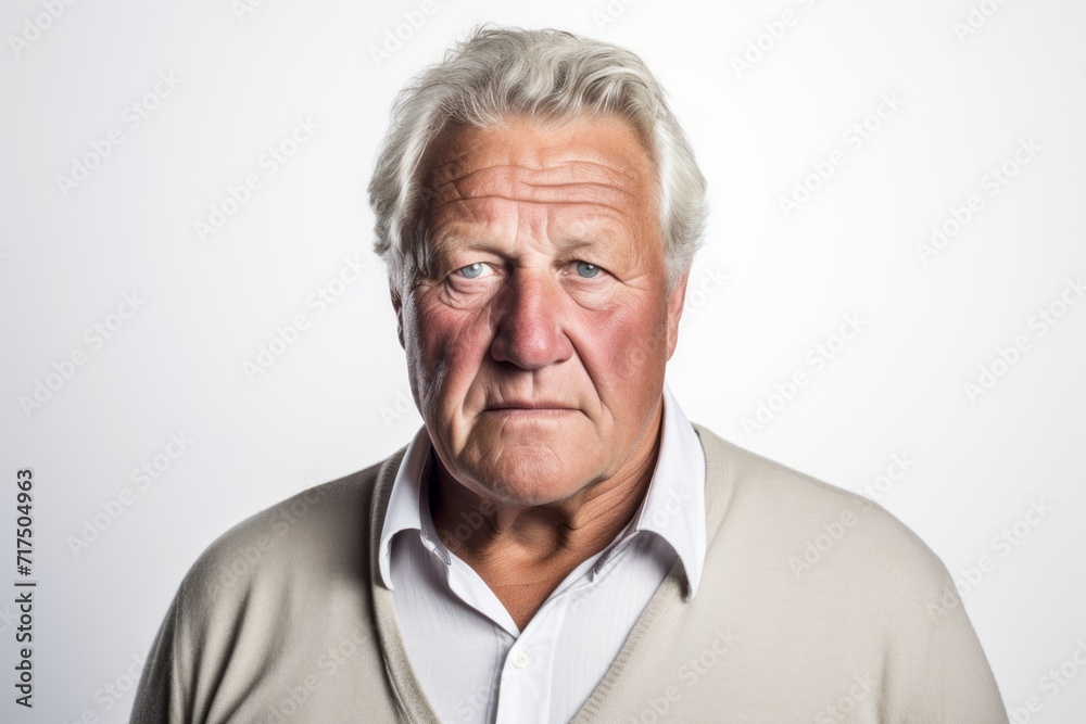 Portrait of a senior man with grey hair. Studio shot. Portrait of a senior man with grey hair. Studio shot.