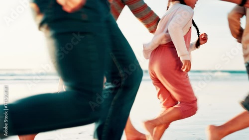 Family, game and running on beach at sunset playing with freedom, happiness and travel on holiday. Summer, vacation and parents bonding, chasing or catch children together on sand for fun adventure photo