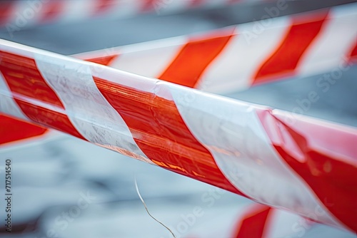 Red and white barrier tape restricts closed area Symbolizes crime scene photo