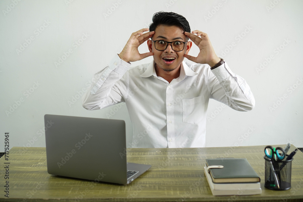 young asian businessman in a workplace with surprise expression, wear white shirt with glasses isolated young asian businessman in a workplace with surprise expression, wear white shirt with glasses isolated
