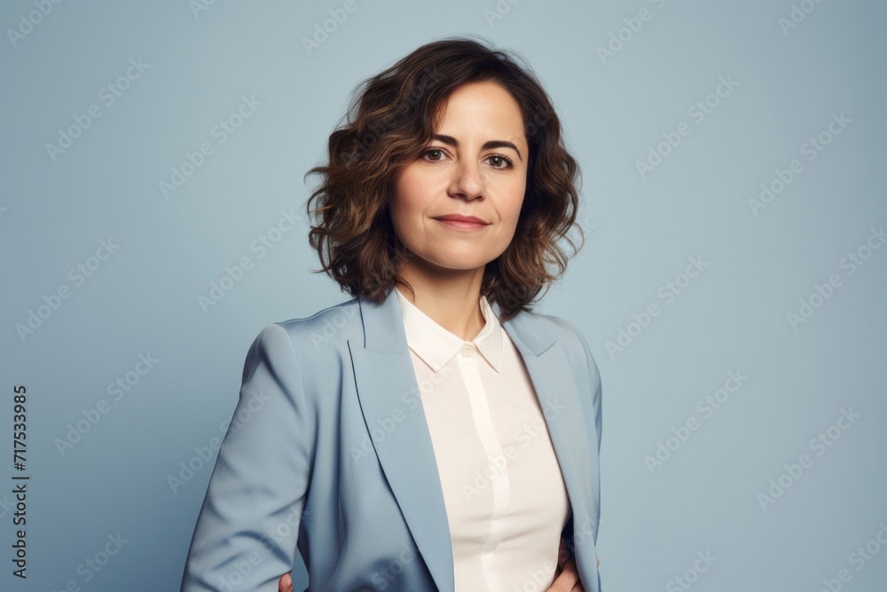 Portrait of confident businesswoman in blue suit looking at camera. Portrait of confident businesswoman in blue suit looking at camera.