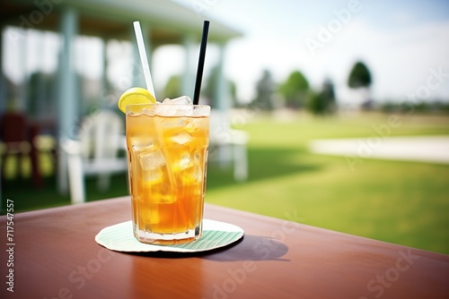 glass of iced tea and lemonade mix on golf course table