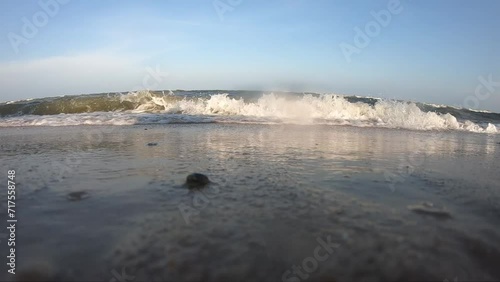 beautiful beach with water wave in summertime, natural slow motion scene background