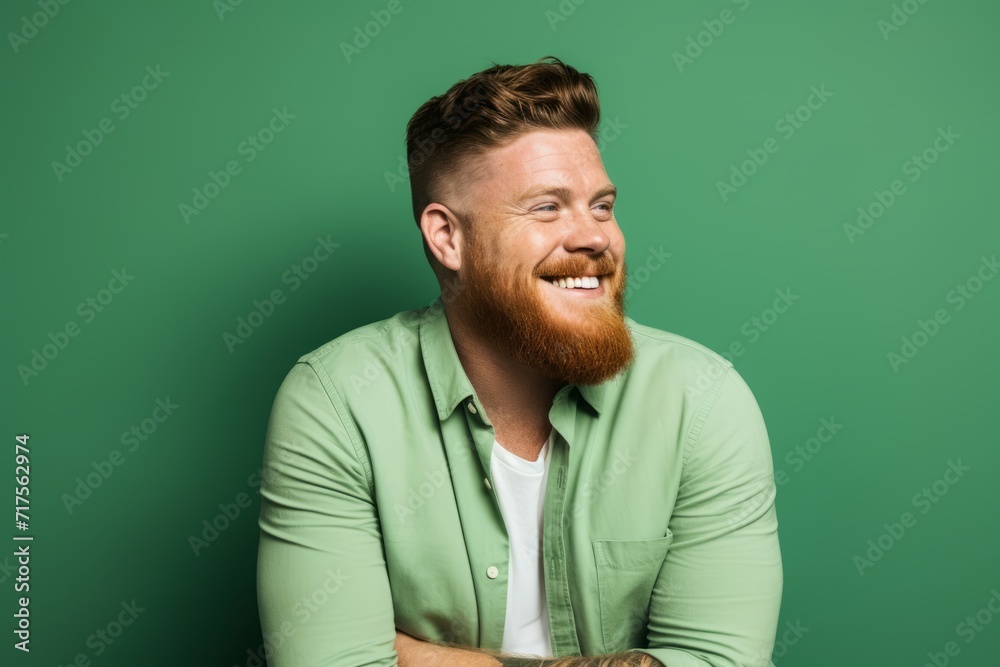 Portrait of a red-bearded man in a green shirt. Portrait of a red-bearded man in a green shirt.