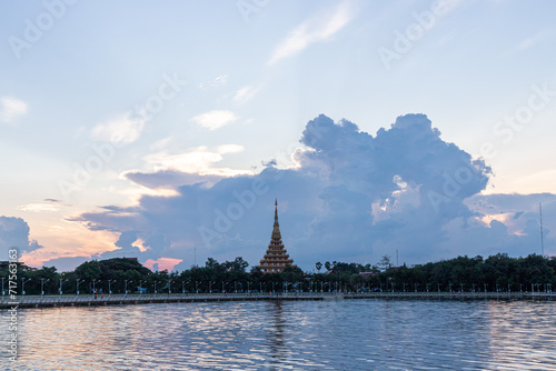Nighttime View of Wat Phra Mahathat Kaen Nakhon, Wat Nong Waeng, in Khon Ka  Thailand, showcasing its ancient Thai architecture, golden pagoda, and cultural significance amidst the city lights photo