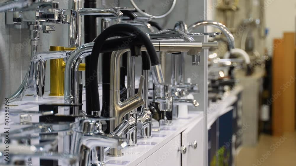 Showcase in the store with faucets for the kitchen and bathroom Showcase in the store with faucets for the kitchen and bathroom
