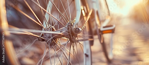 Macro image of a new high end bicycle cycle with a detailed view of a single silver colored bike spoke that has significant motion blur as the wheel rotates Part of a series of photos on this t