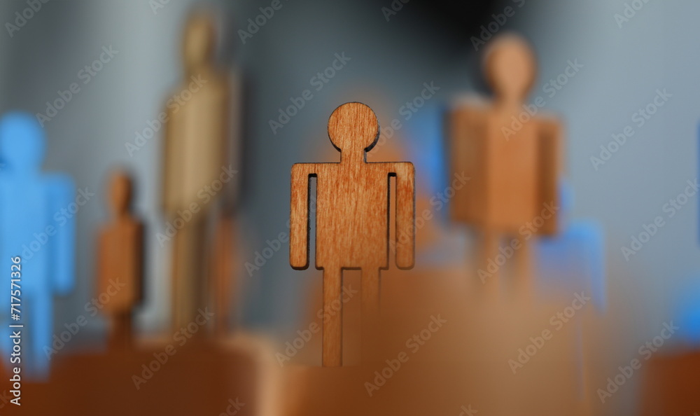 Close-up, wooden mans flat figure, political puppet. Prestigious job for people. Protection labor rights workers. Figures people for presentation wooden and plastic. Manipulative methods Close-up, wooden mans flat figure, political puppet. Prestigious job for people. Protection labor rights workers. Figures people for presentation wooden and plastic. Manipulative methods