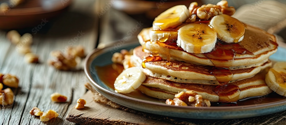 Pancakes with banana walnut and caramel for a breakfast. Copy space image. Place for adding text or design
