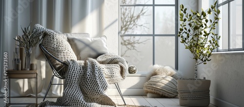 Hand knitted merino wool chunky blanket in interior on background Stylish and cozy Scandinavian interior bed chair white wall. Copy space image. Place for adding text or design photo