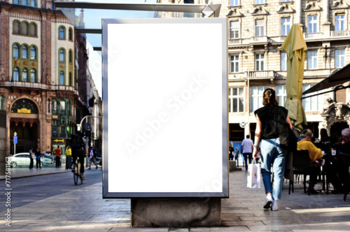 blank digital ad panel. billboard display. empty white lightbox sign at busstop. mockup template. city transit station. urban street setting. outdoor advertising. photo