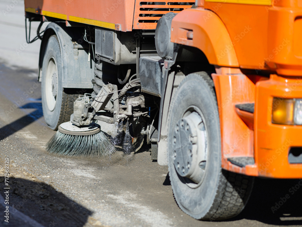 Brush for cleaning the asphalt of a car cleaning a road in the city.Municipal street cleaning service. Brush for cleaning the asphalt of a car cleaning a road in the city.Municipal street cleaning service.