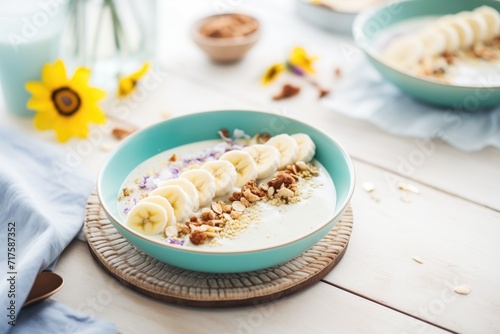 protein smoothie bowl with granola and banana slices on top