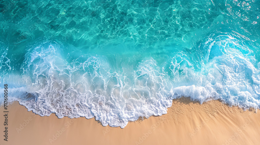 Aerial view of a white sand beach with crystal clear turquoise waters, waves, and shoreline Aerial view of a white sand beach with crystal clear turquoise waters, waves, and shoreline