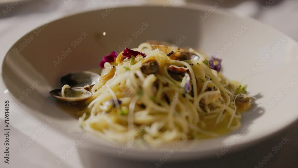 Fancy Pasta With Mussels And Flowers On Table In Restaurant. Fancy Pasta With Mussels And Flowers On Table In Restaurant.