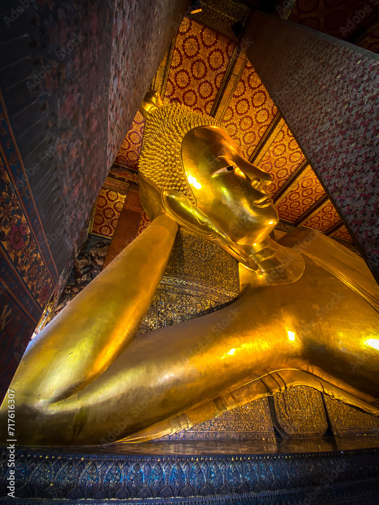 Wat Pho temple. Big Reclining golden Buddha statue (Phra Buddhasaiyas). Bangkok. Thailand.