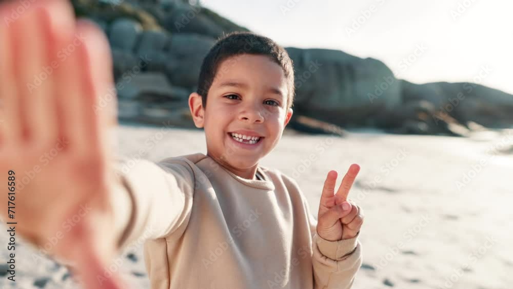 Young child, selfie and happiness on face on beach, relax and peace sign on summer vacation. Little boy, smile and portrait with gestures on holiday, leisure and travel adventure in nature by seaside Young child, selfie and happiness on face on beach, relax and peace sign on summer vacation. Little boy, smile and portrait with gestures on holiday, leisure and travel adventure in nature by seaside