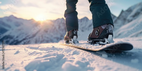 A person standing on a snowboard in the snow. Suitable for winter sports and outdoor activities