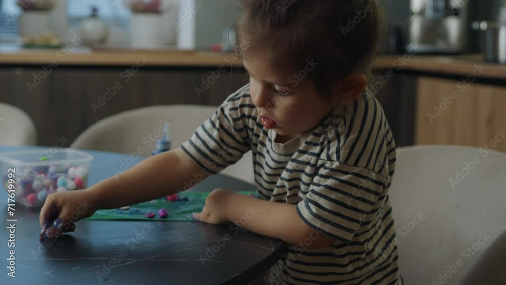 Little girl playing with colorful sticky elastic plasticine. Homemade plasticine, plasticine. Molding clay or slime. Homemade clay. Little girl playing with colorful sticky elastic plasticine. Homemade plasticine, plasticine. Molding clay or slime. Homemade clay.