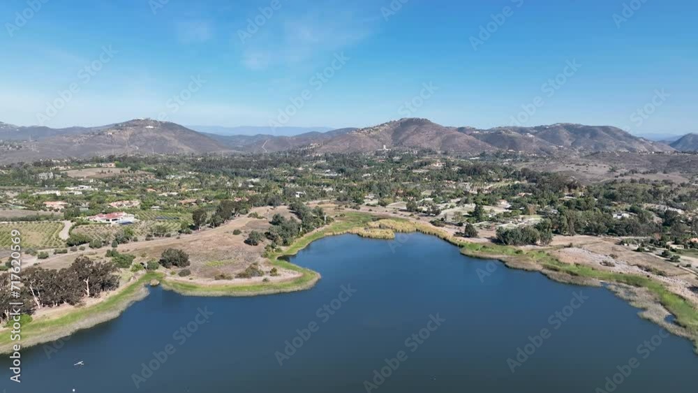 Aerial view over water reservoir and a large dam that holds water. Rancho Santa Fe in San Diego, California, USA Aerial view over water reservoir and a large dam that holds water. Rancho Santa Fe in San Diego, California, USA