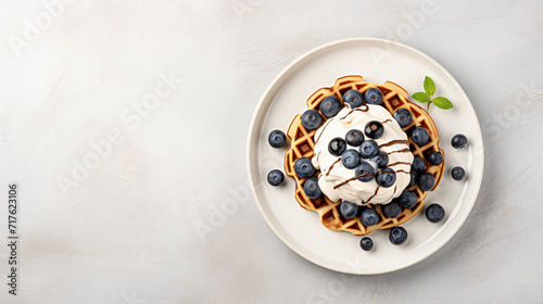 Homemade waffles with blueberries chocolate sauce