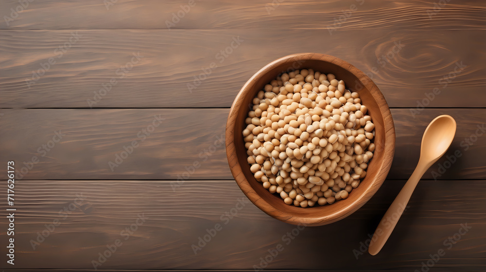 Soybeans in wooden bowl with soy milk on wooden table, top view, copy space Soybeans in wooden bowl with soy milk on wooden table, top view, copy space