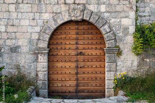 An old decorated vintage door in the old town of Perast, in Kotor bay, Мontenegro