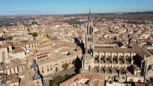 Toledo, Spain: Aerial drone footage of the famous Toledo cathedral in the medieval old town in the Castilla-La Mancha in central Spain. Shot with a tilt down motion photo