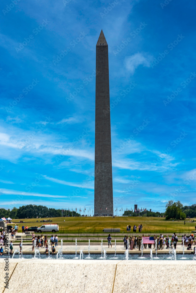 The National World War II Memorial with the George Washington Obelisk on the National Mall in Washington DC, USA.