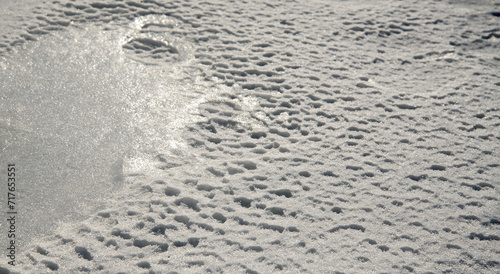 Winter landscape - frozen sea surface with snow.