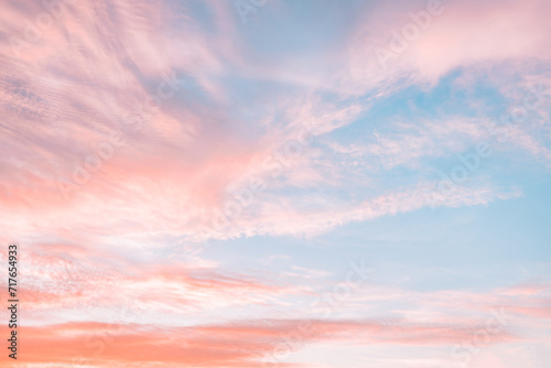 Fototapeta Naklejka Na Ścianę i Meble -  A beautiful sky tinted by the sun leaving vibrant shades of gold, pink, blue and multicolored. Clouds in the twilight evening and morning sky. Cloudy sky background in the evening and during the day.