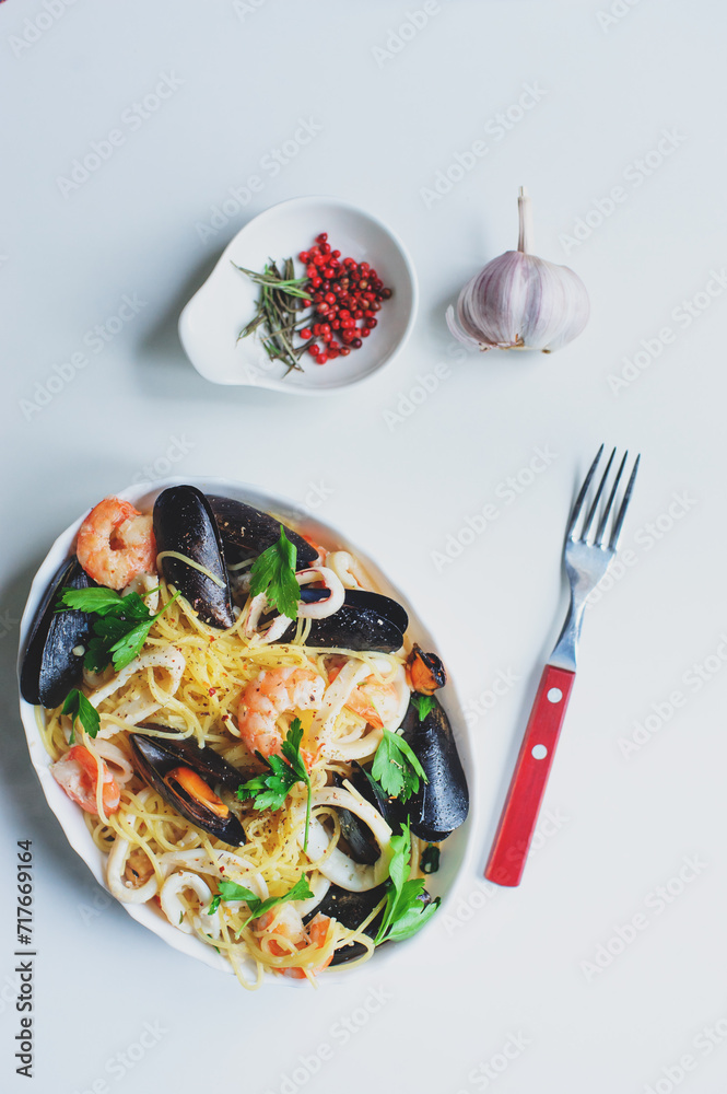 tasty gourmet spicy seafood pasta with shrimps, squid and mussels cooked with pink pepper and thyme tasty gourmet spicy seafood pasta with shrimps, squid and mussels cooked with pink pepper and thyme