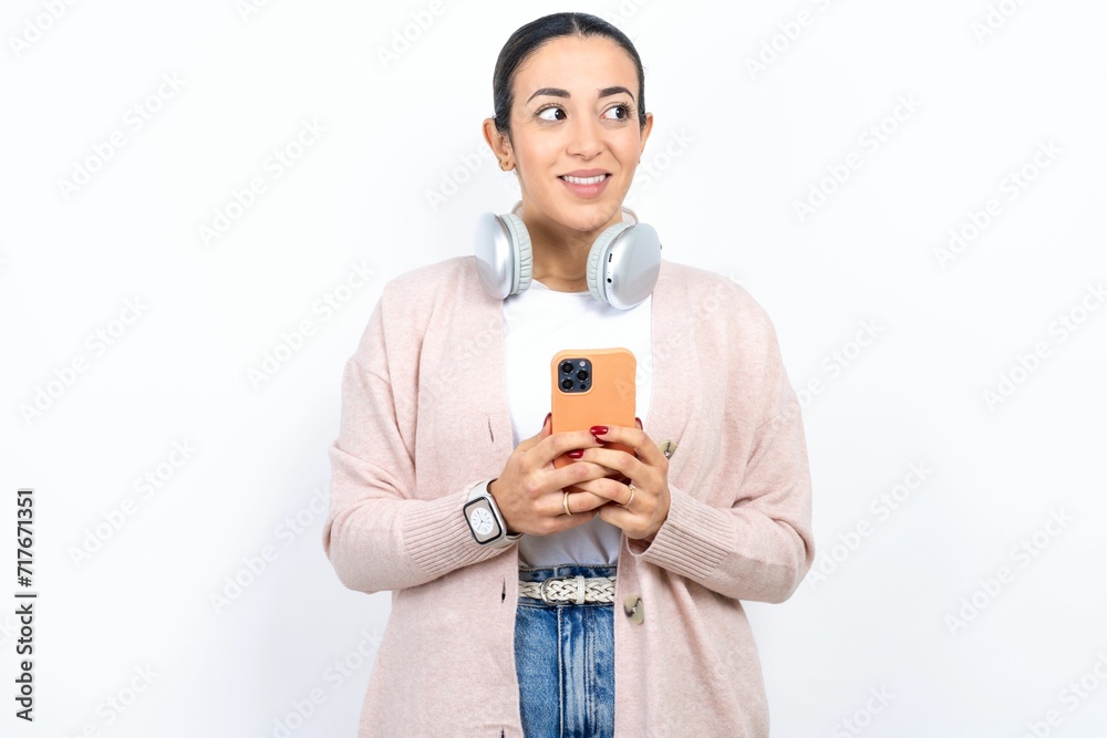 Young beautiful woman hold telephone hands read good youth news look empty space advert Young beautiful woman hold telephone hands read good youth news look empty space advert