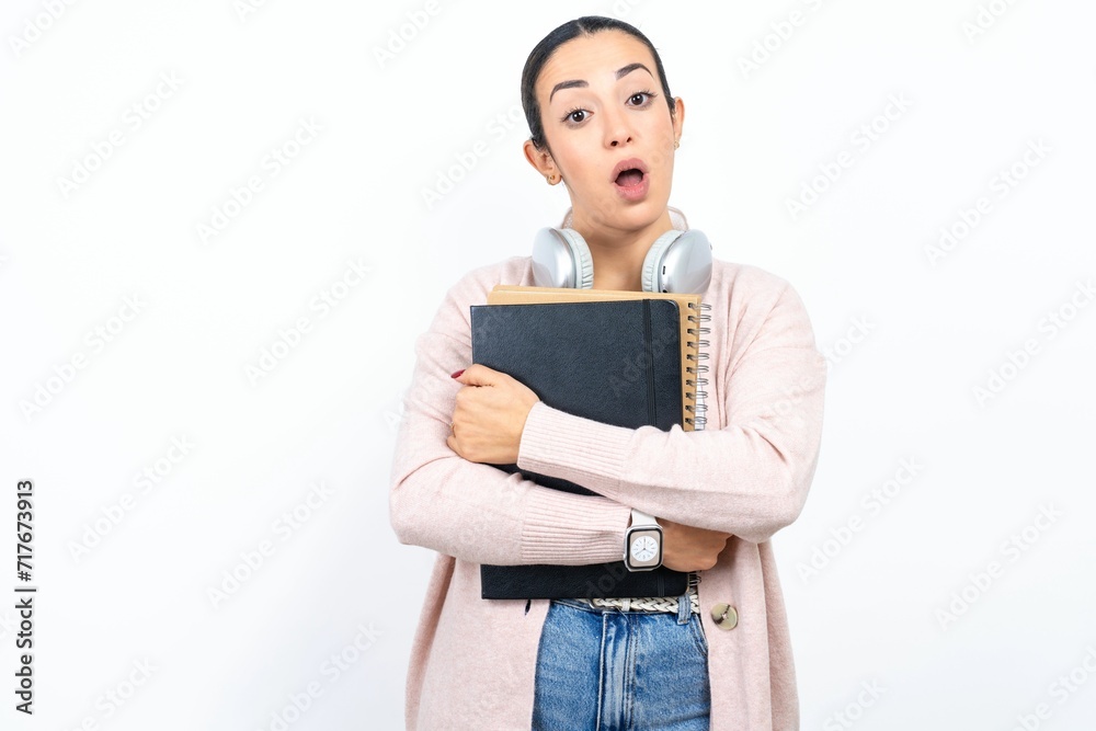 Shocked embarrassed Young beautiful woman keeps mouth widely opened. Hears unbelievable novelty stares in stupor Shocked embarrassed Young beautiful woman keeps mouth widely opened. Hears unbelievable novelty stares in stupor