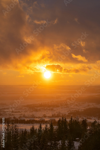 winter evening  sunset in yellow  orange and pink with clouds  background