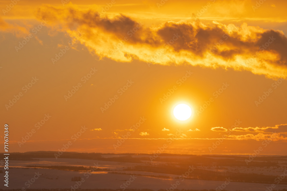 winter evening, sunset in yellow, orange and pink with clouds, background winter evening, sunset in yellow, orange and pink with clouds, background